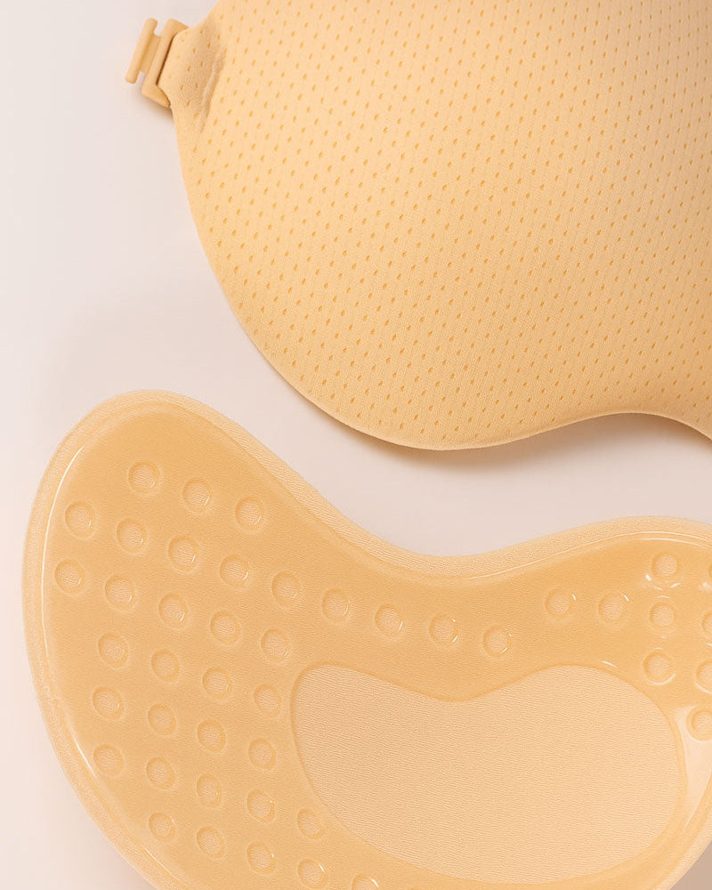 Beige silicone sticky bra detail form on a light background