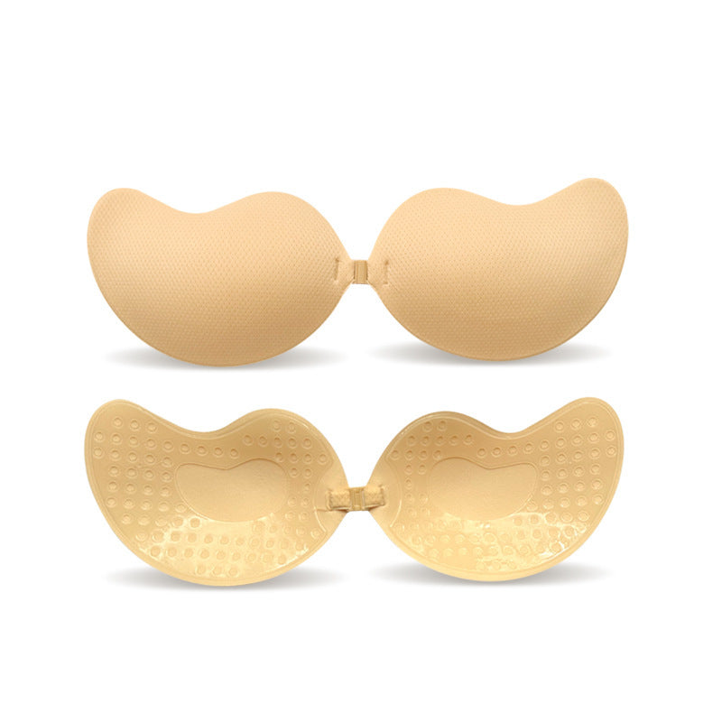 Beige sticky strapless and backless bras on a white background