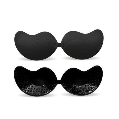 Black sticky backless and strapless bras on a white background